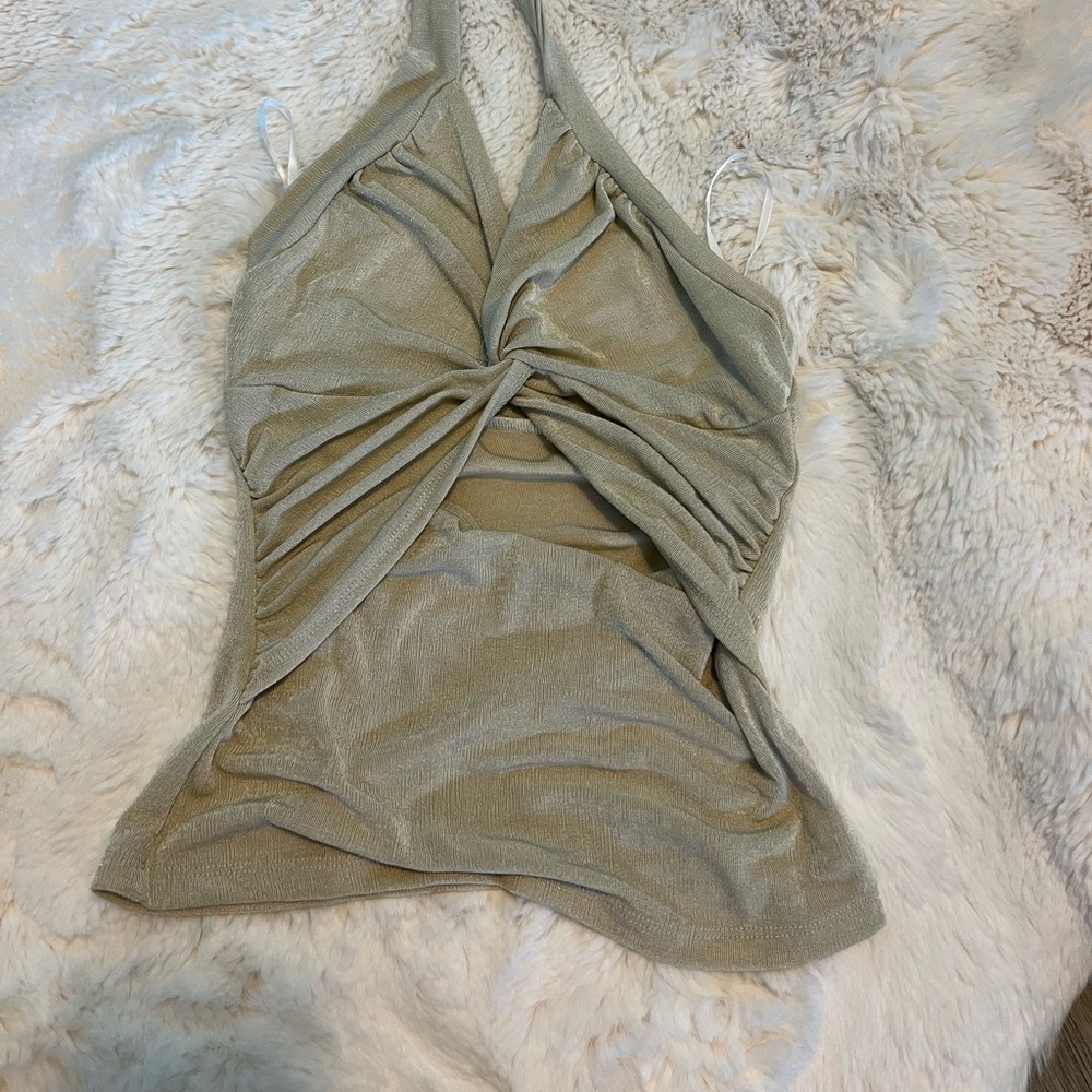 Size small. Tan/cream color